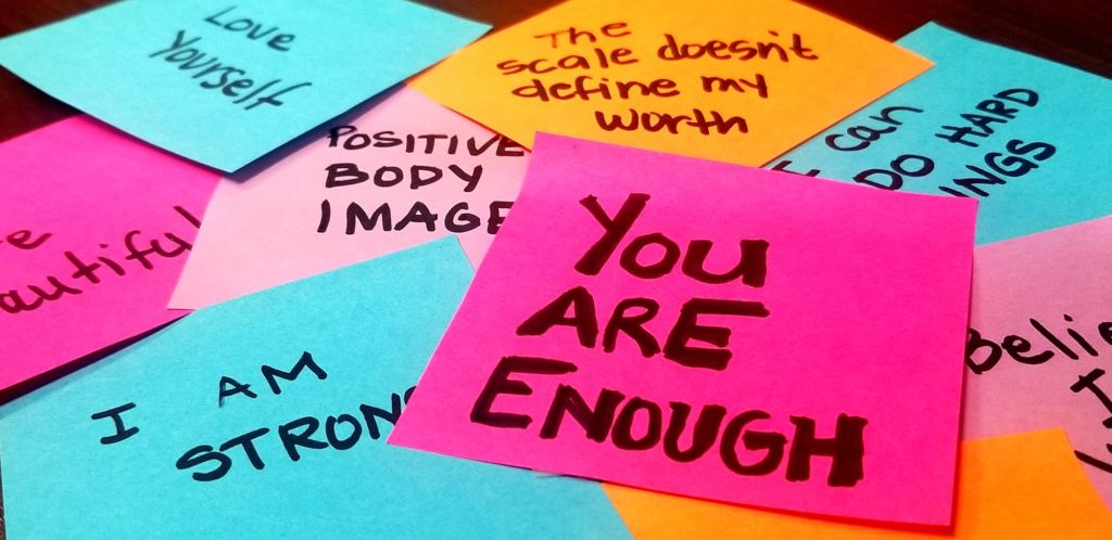 Brightly Colored Post It Notes With Positive Affirmations.