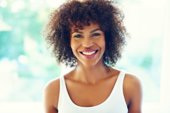 Happy curly woman.