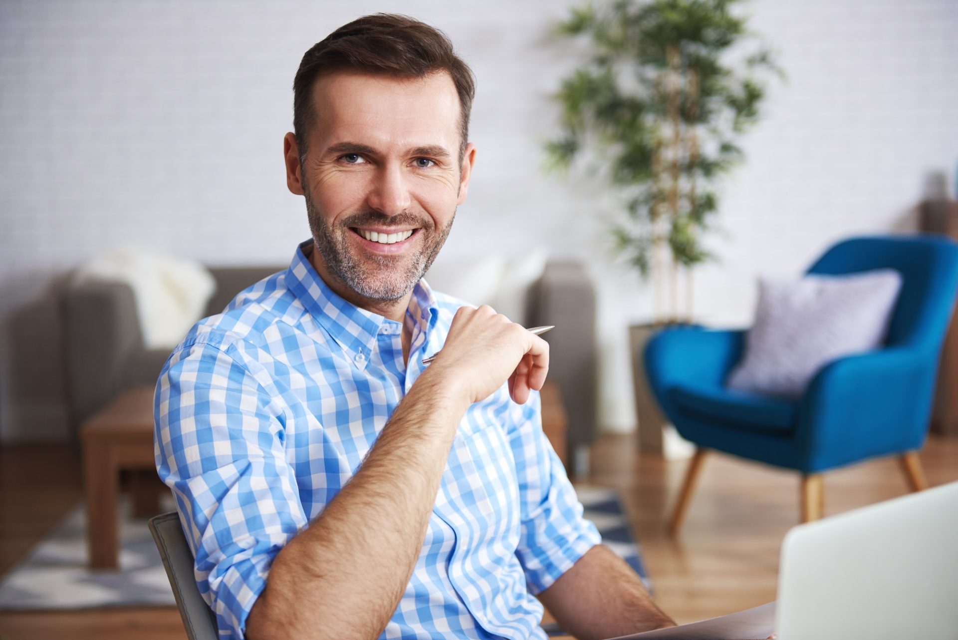 Portrait of confident man in home office
